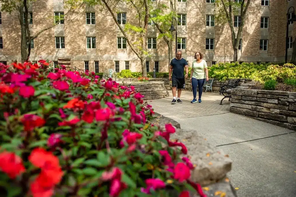 a couple walking through a park