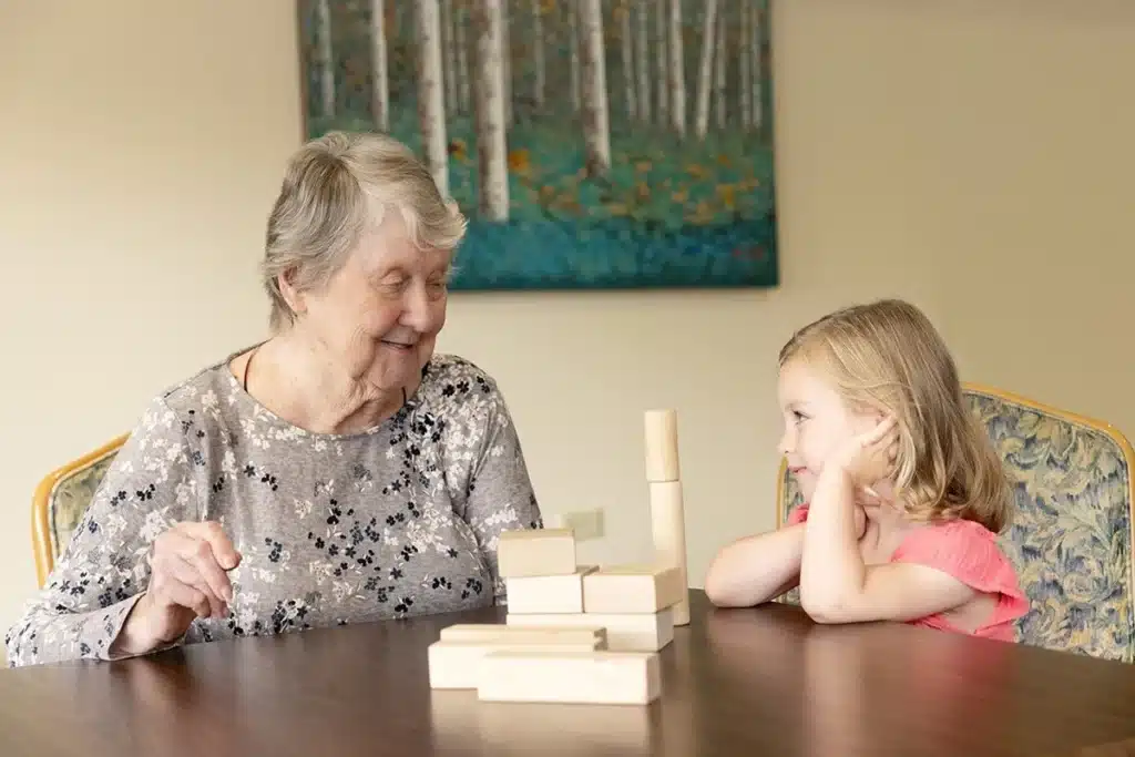an older woman and a young girl playing together