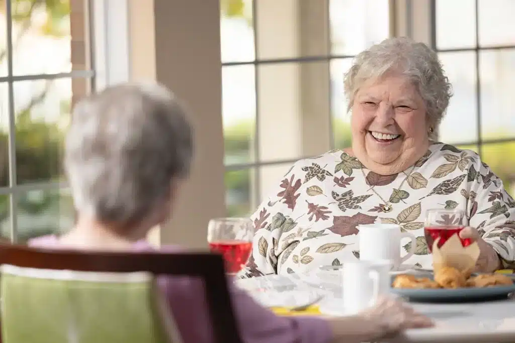 a group of women eating at a dining area in lutheran home